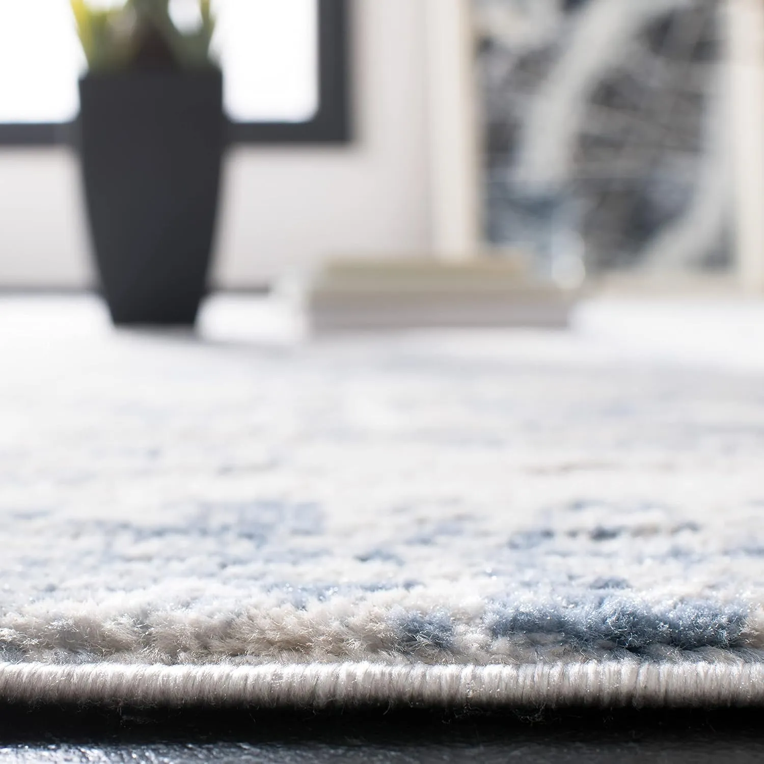 SAFAVIEH Amelia Collection Area Rug - 9' x 12', Ivory & Blue, Modern Abstract Design, Non-Shedding & Easy Care, Ideal for High Traffic Areas in Living Room, Bedroom (ALA700A)