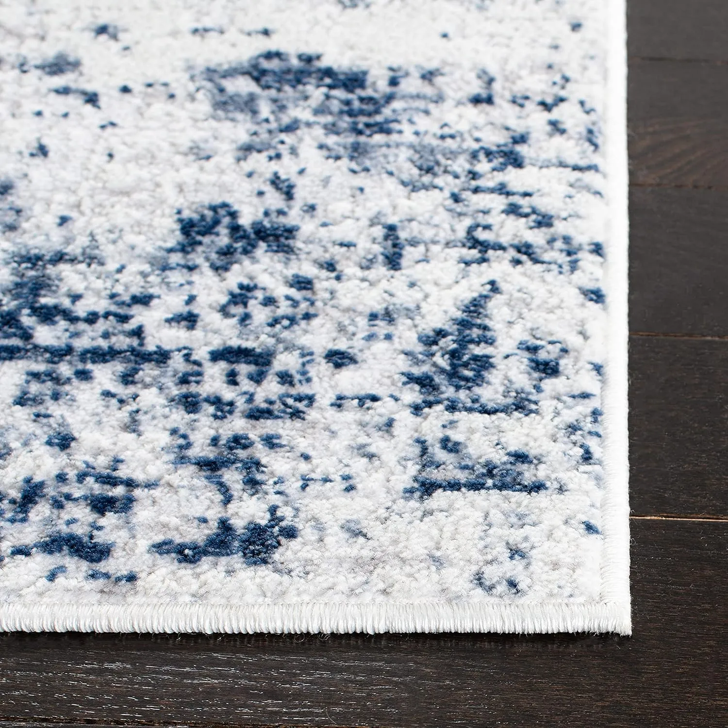 SAFAVIEH Amelia Collection Area Rug - 9' x 12', Ivory & Navy, Modern Abstract Design, Non-Shedding & Easy Care, Ideal for High Traffic Areas in Living Room, Bedroom (ALA700B)